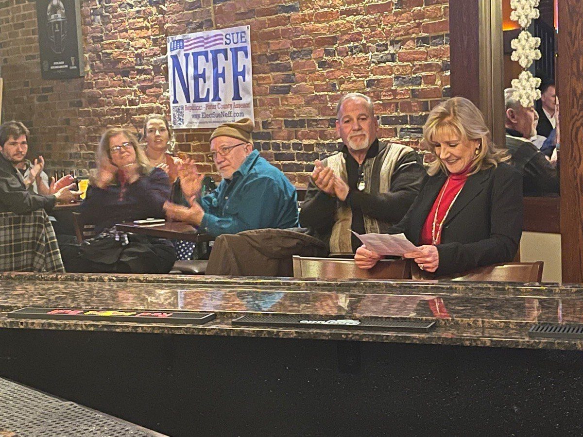 Sue speaking with residents at a meet and greet