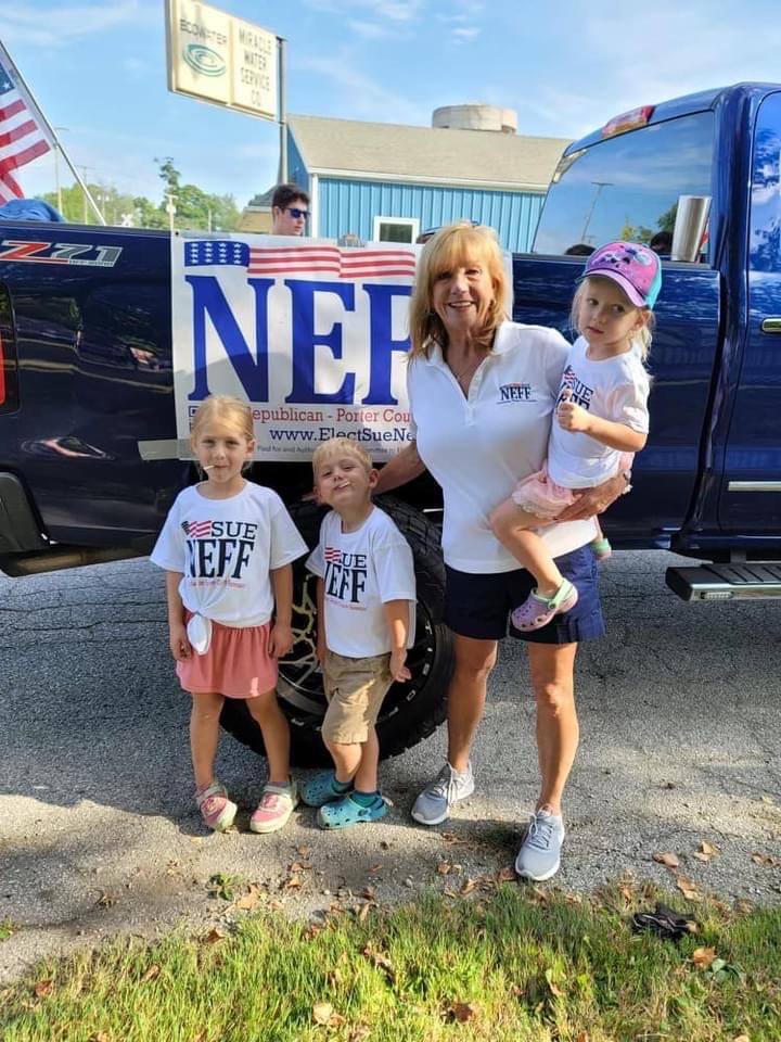Sue with three young children wearing Neff shirts